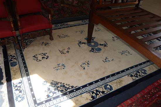 A large blue and white Chinese rug, 350 x 255cm